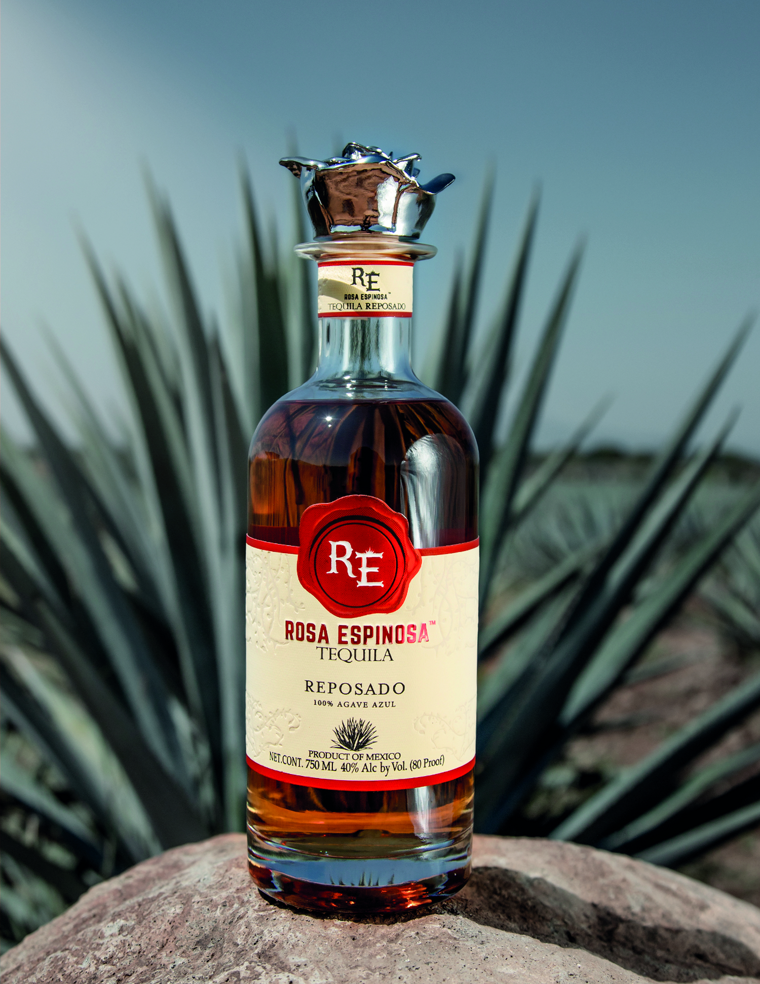 Rosa Espinosa Tequila Reposado in front of agave